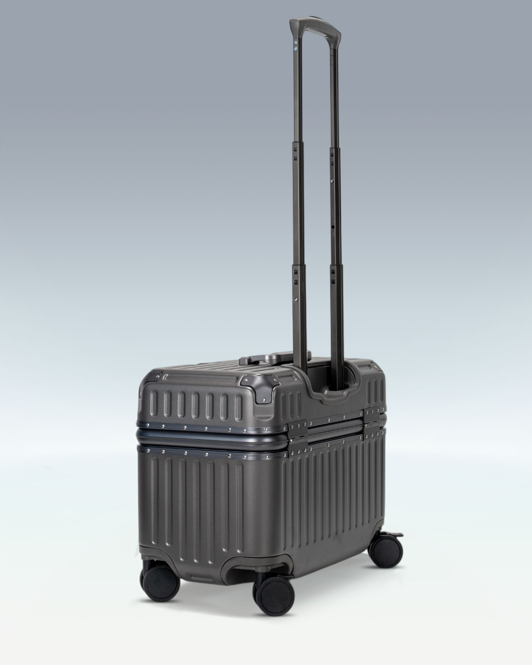 Portar Concord EdgeFrame pilot carry-on luggage in Dark Gull Gray, side profile with the telescoping handle extended