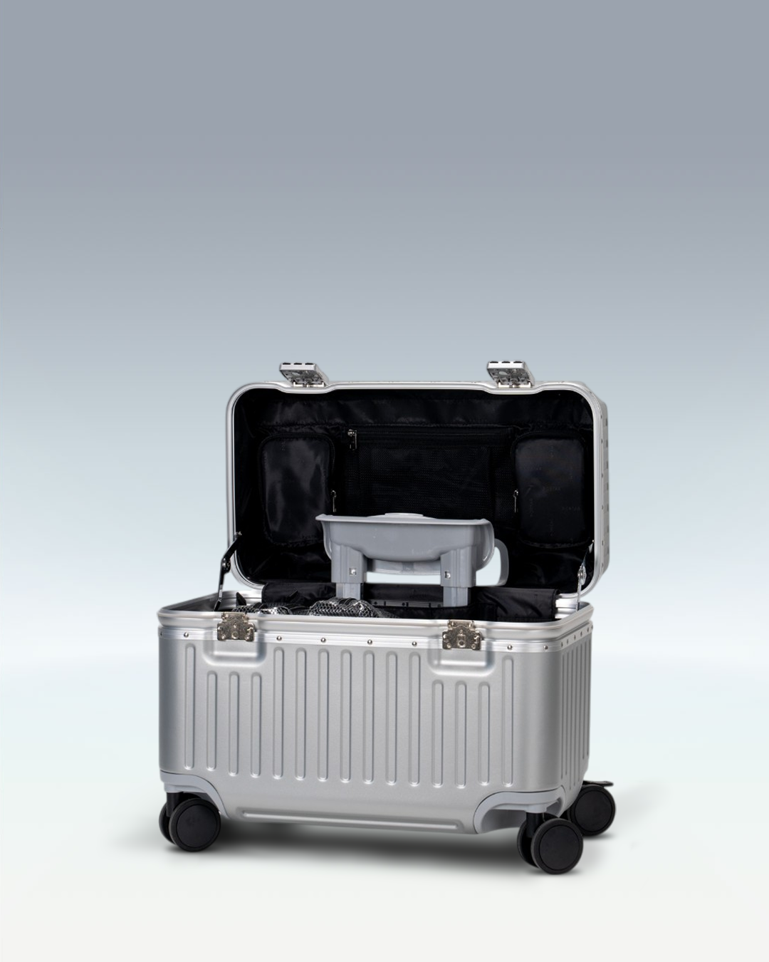 Portar Concord EdgeFrame pilot carry-on luggage in Lunar Silver, opened from the top, showing the interior and the padded laptop compartment