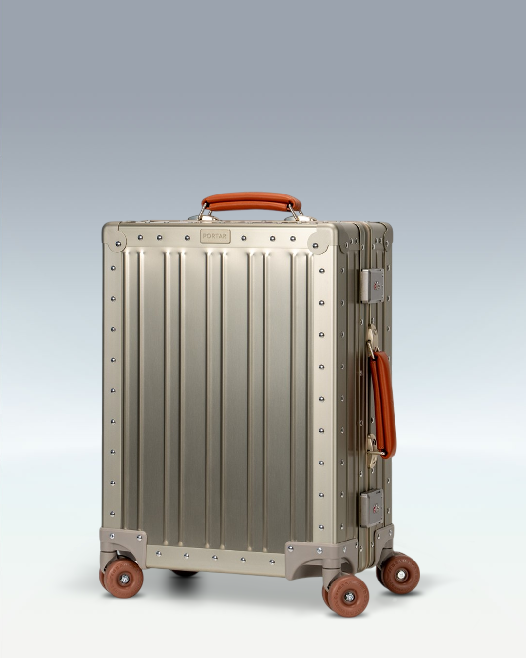 Portar Lucent aluminum carry-on luggage in Champagne Gold, three-quarter front view