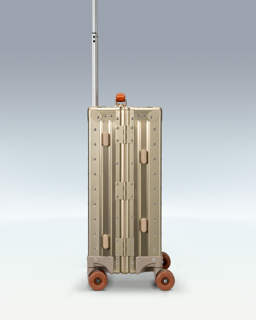 Portar Lucent aluminum carry-on luggage in Champagne Gold, side profile