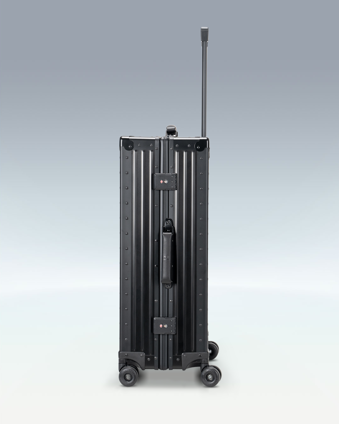 Portar Lucent aluminum checked luggage in Jet Black, side view showing the TSA-approved combination locks
