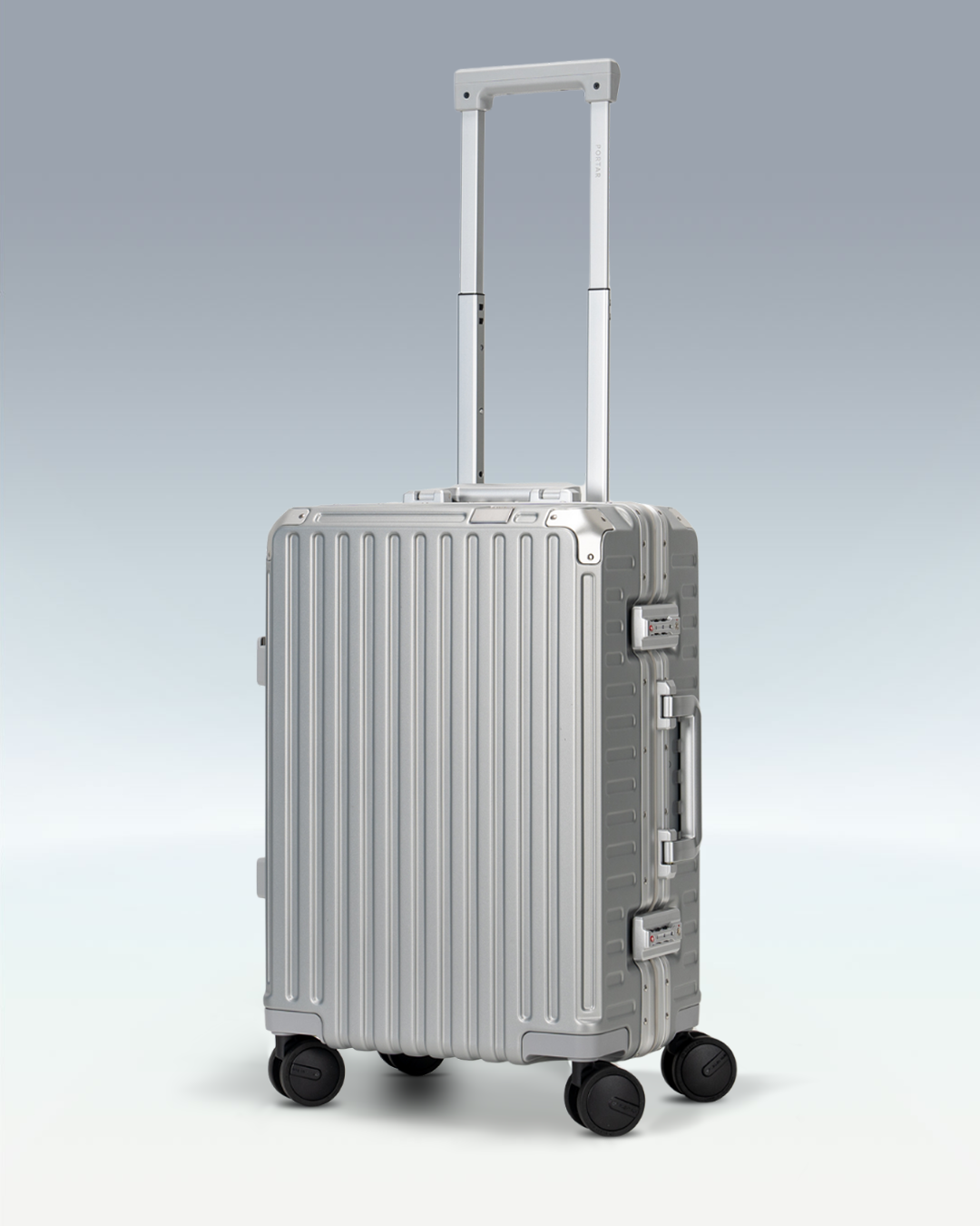 Portar Valence EdgeFrame carry-on luggage in Lunar Silver, three-quarter view with the telescoping handle extended