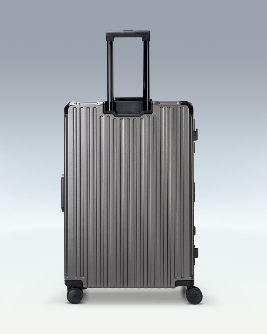 Portar Valence EdgeFrame checked luggage in Dark Gull Gray, back view with the telescoping handle extended