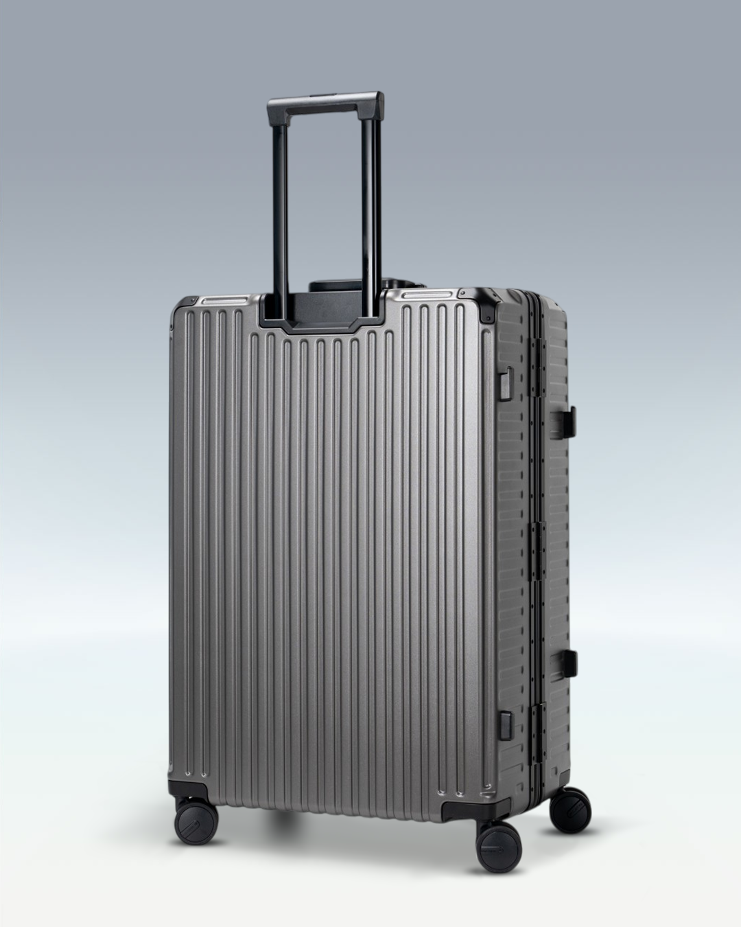 Portar Valence EdgeFrame checked luggage in Dark Gull Gray, angled side view with the telescoping handle extended