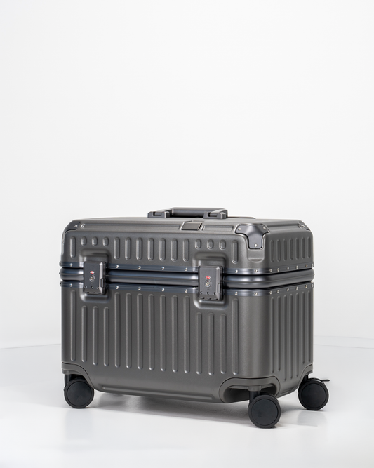 Gray pilot suitcase with wheels on a white background