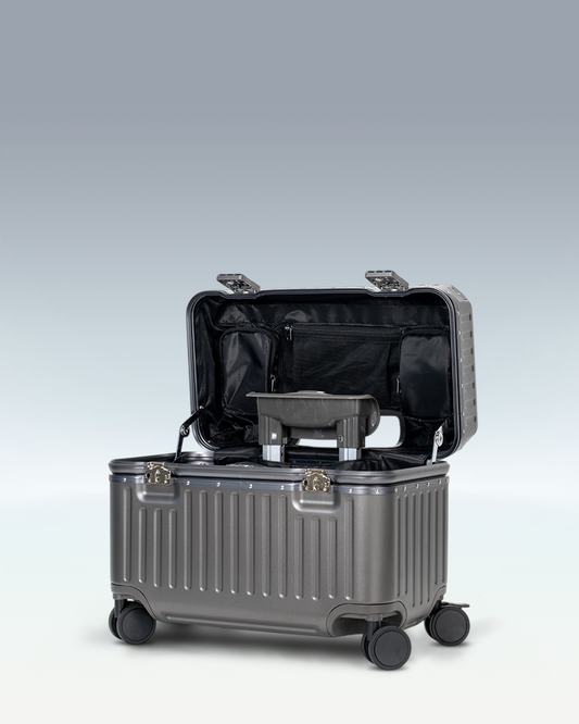 Portar Concord EdgeFrame pilot carry-on luggage in Dark Gull Gray, opened from the top, showing the interior and the padded laptop compartment