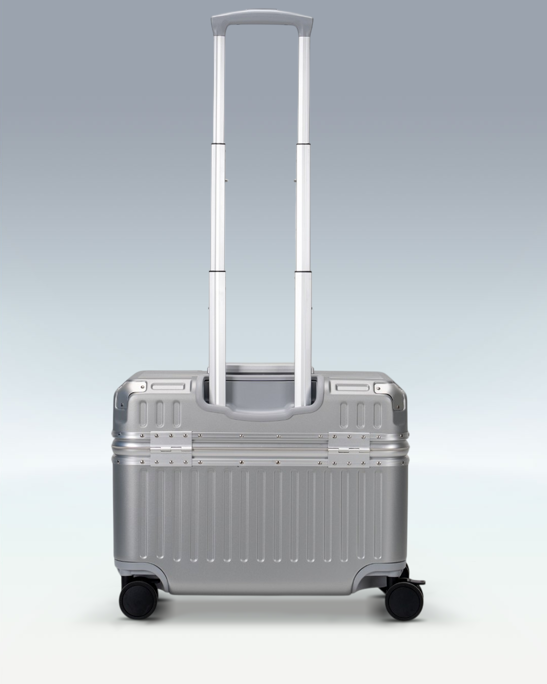 Portar Concord EdgeFrame pilot carry-on luggage in Lunar Silver, back view with the telescoping handle extended