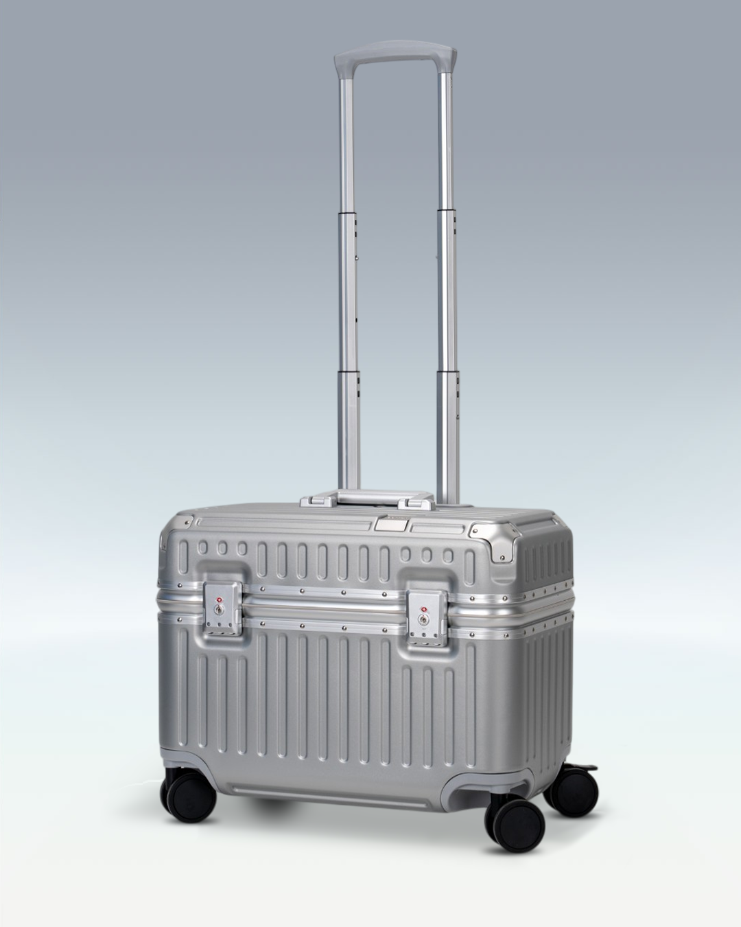 Portar Concord EdgeFrame pilot carry-on luggage in Lunar Silver, three-quarter view with the telescoping handle extended