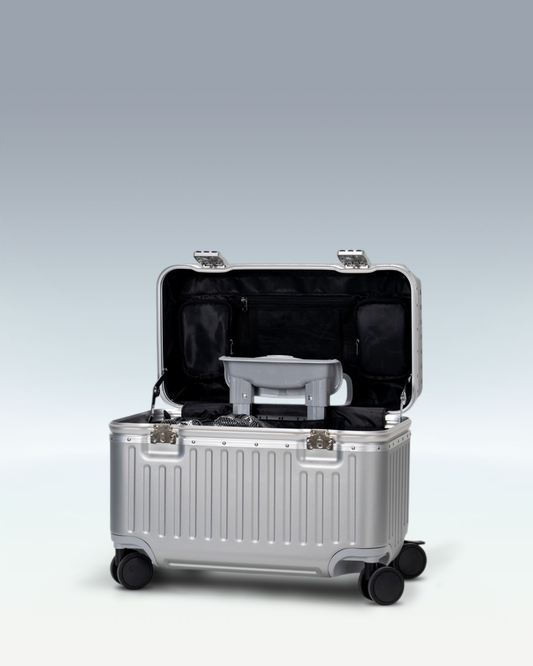 Portar Concord EdgeFrame pilot carry-on luggage in Lunar Silver, opened from the top, showing the interior and the padded laptop compartment