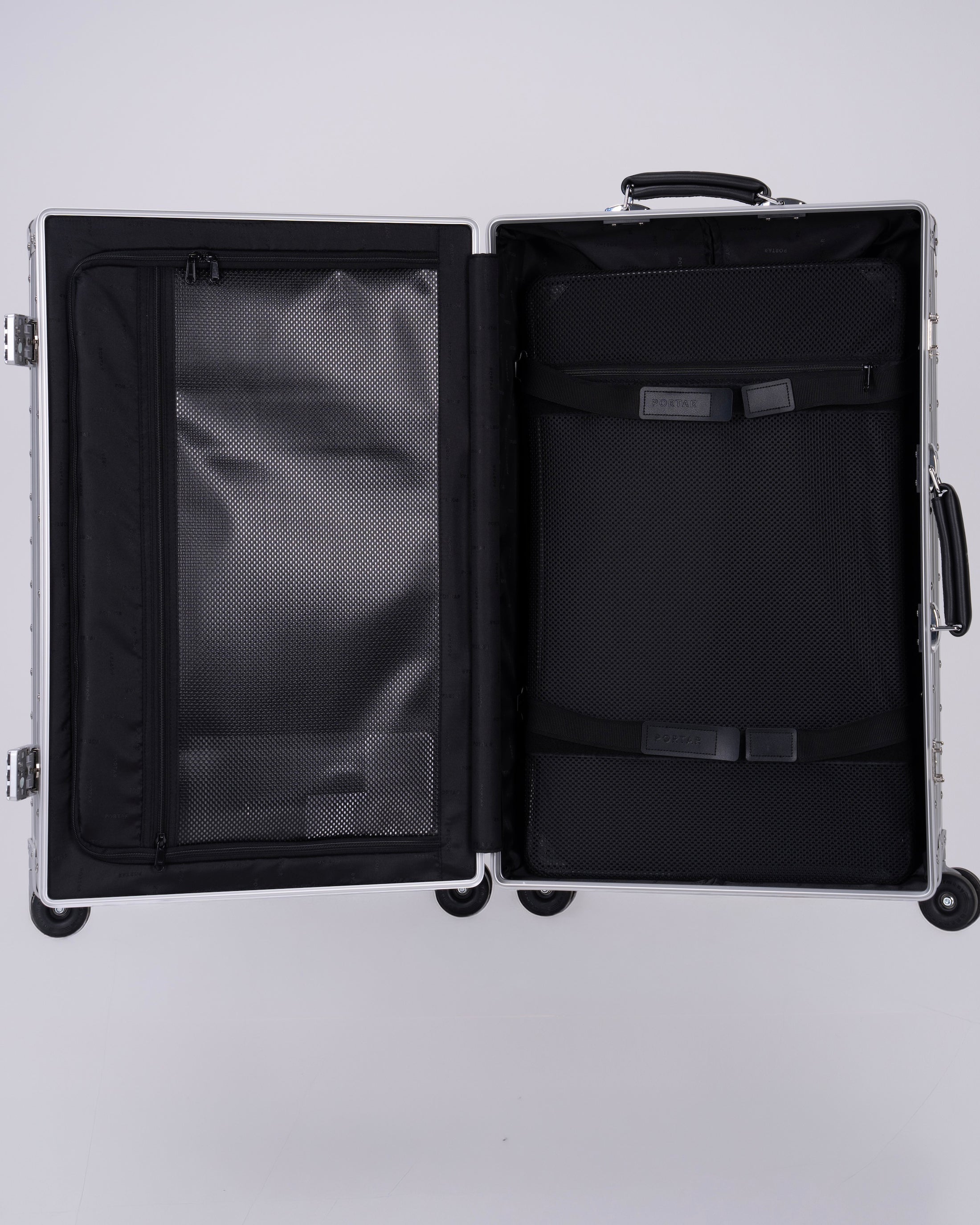 Portar Aluminum Carry on suitcase Open  with interior details on a light gray background