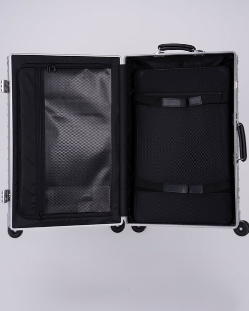 Portar Aluminum Carry on suitcase Open  with interior details on a light gray background