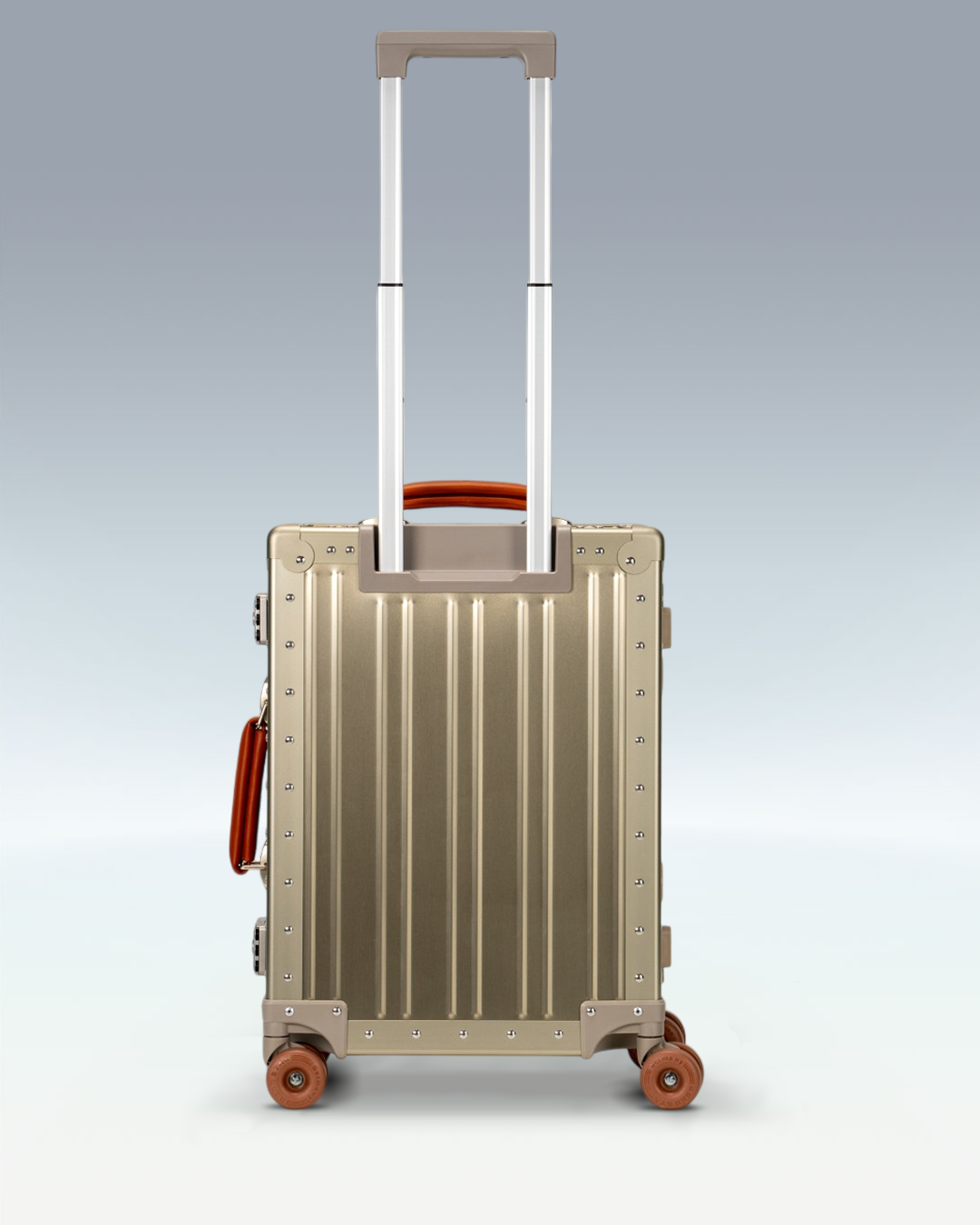 Portar Lucent aluminum carry-on luggage in Champagne Gold, back view with the telescoping handle extended