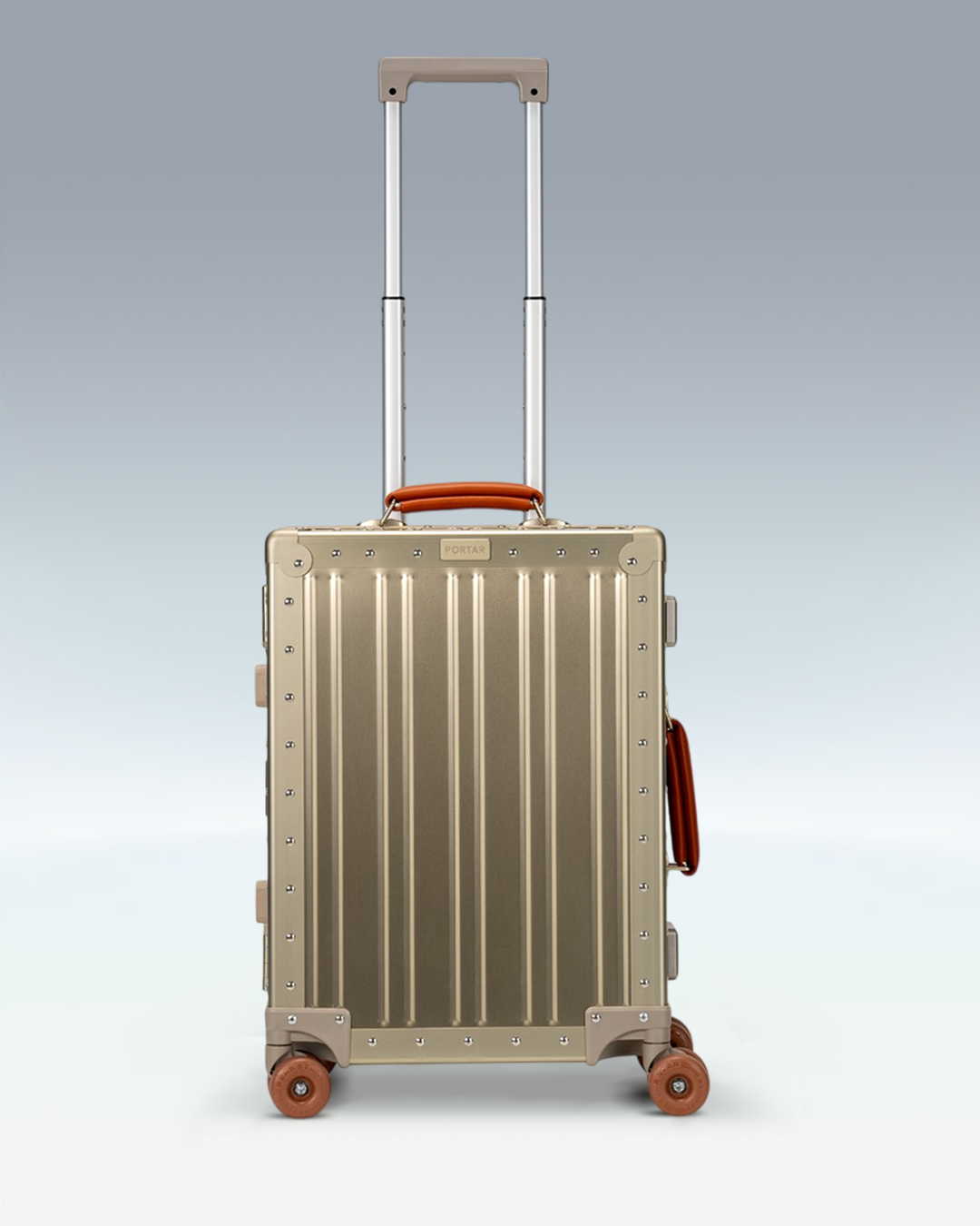 Portar Lucent aluminum carry-on luggage in Champagne Gold, front view with the telescoping handle extended