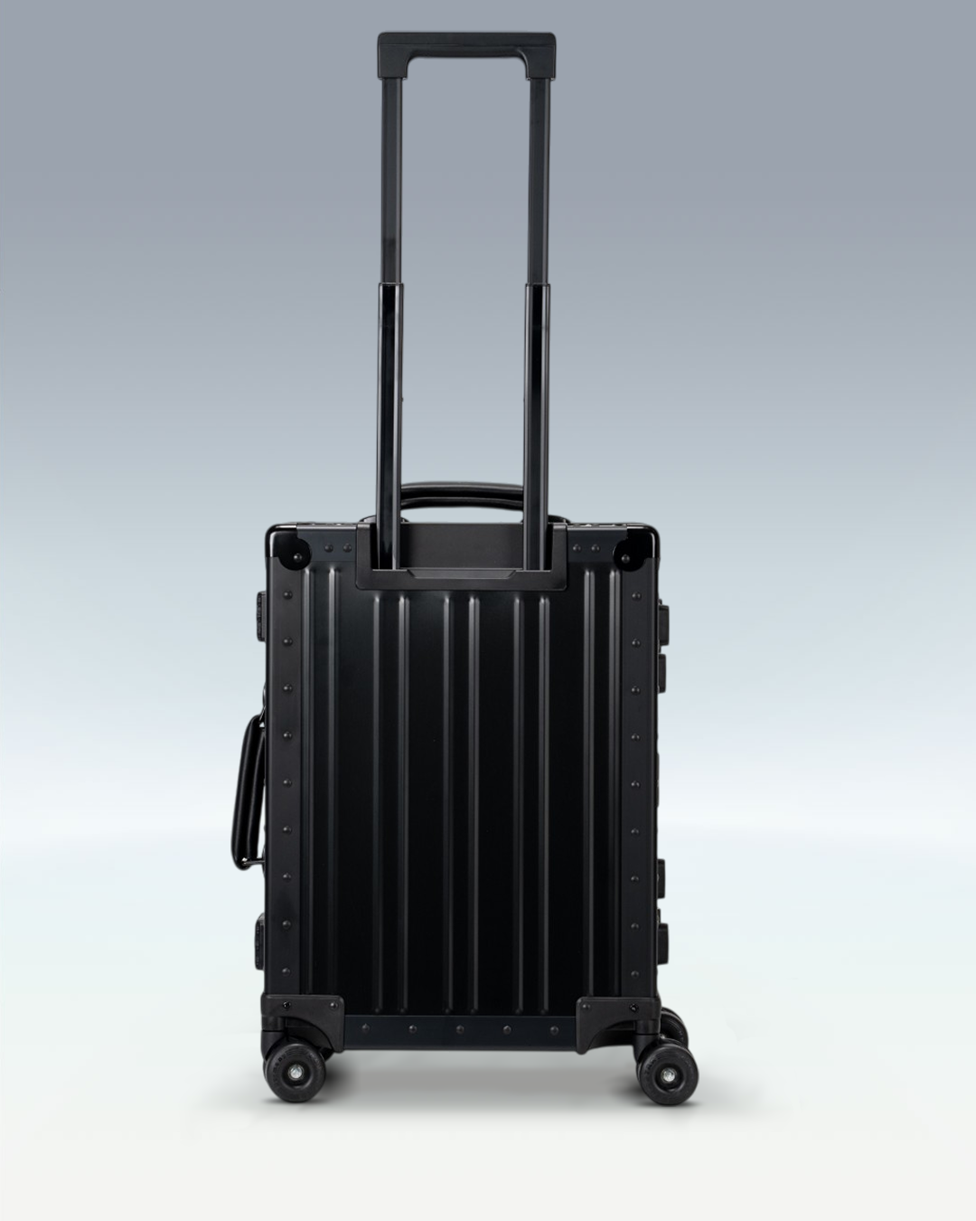 Portar Lucent aluminum carry-on luggage in Jet Black, back view with the telescoping handle extended