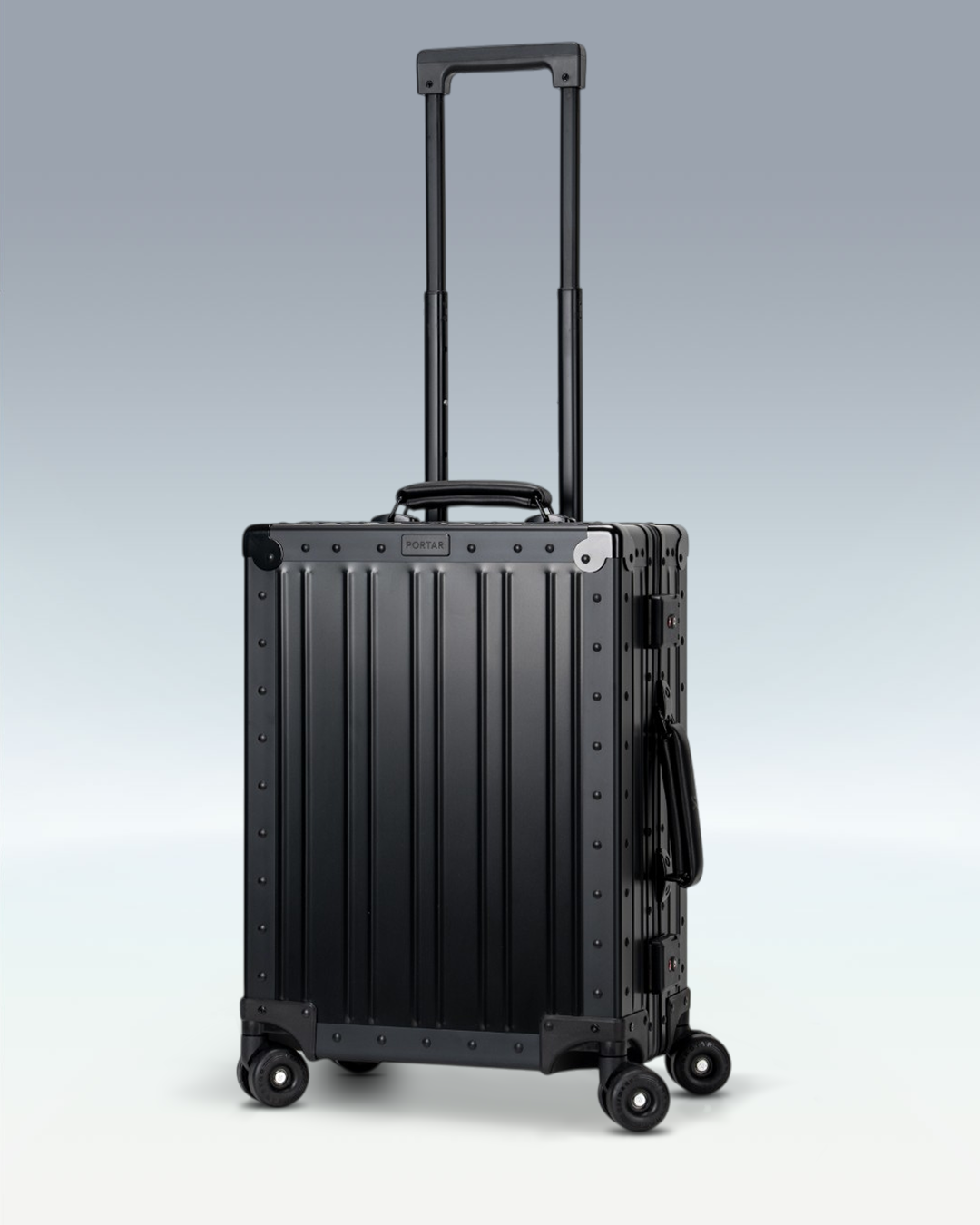 Portar Lucent aluminum carry-on luggage in Jet Black, three-quarter view with the telescoping handle extended