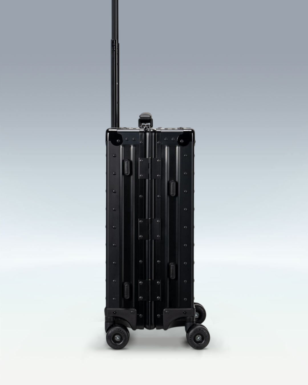 Portar Lucent aluminum carry-on luggage in Jet Black, side profile