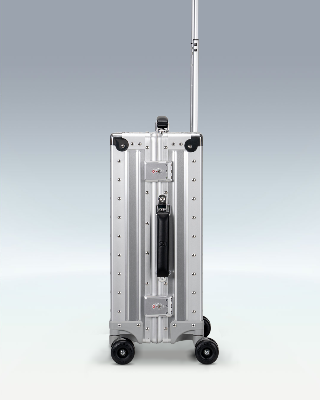 Portar Lucent aluminum carry-on luggage in Lunar Silver, side view showing the TSA-approved combination locks