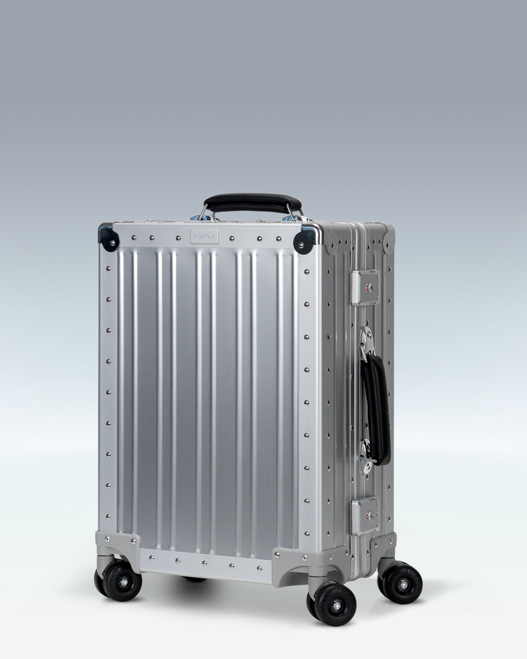 Portar Lucent aluminum carry-on luggage in Lunar Silver, three-quarter front view