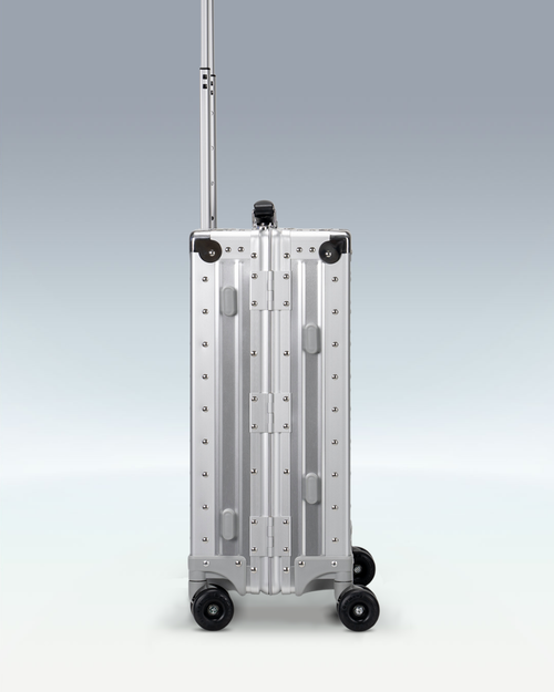 Portar Lucent aluminum carry-on luggage in Lunar Silver, side profile