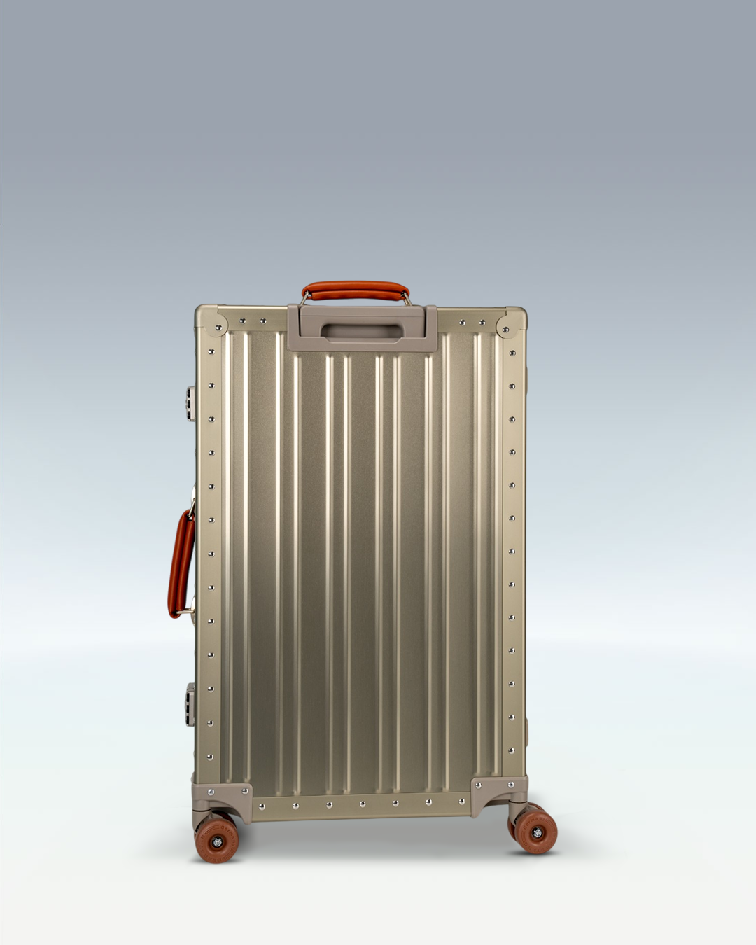 Portar Lucent aluminum checked luggage in Champagne Gold, back view