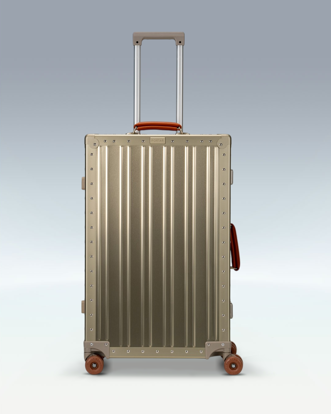 Portar Lucent aluminum checked luggage in Champagne Gold, front view with the telescoping handle extended