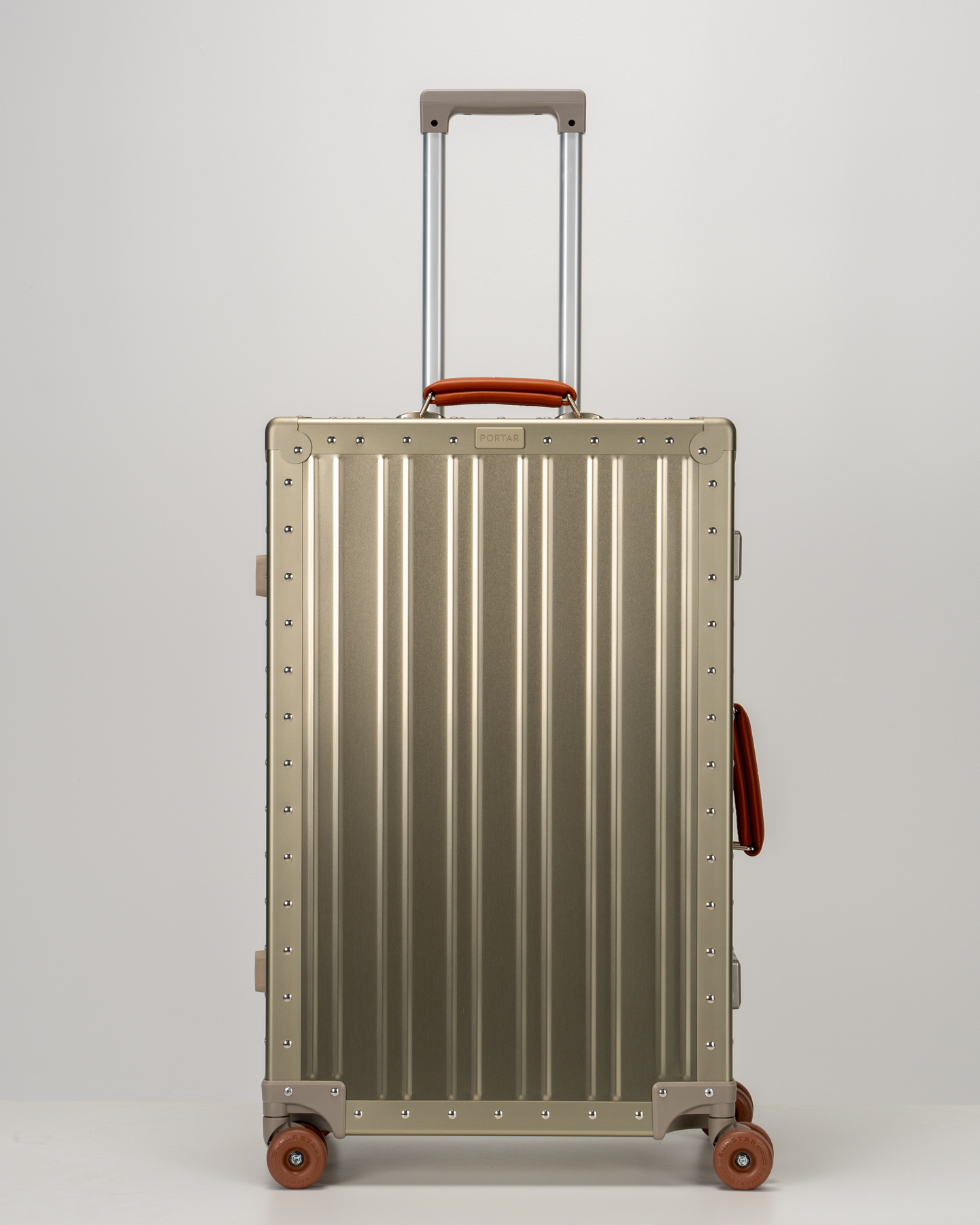 Lucent Champagne Gold Aluminum Check-In Suitcase Front with Handle View by Portar