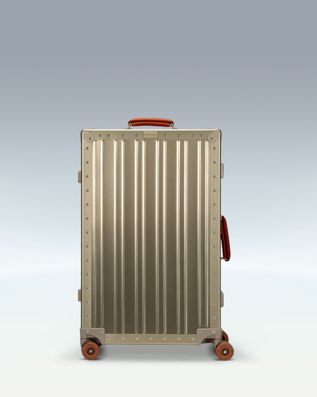 Portar Lucent aluminum checked luggage in Champagne Gold, front view