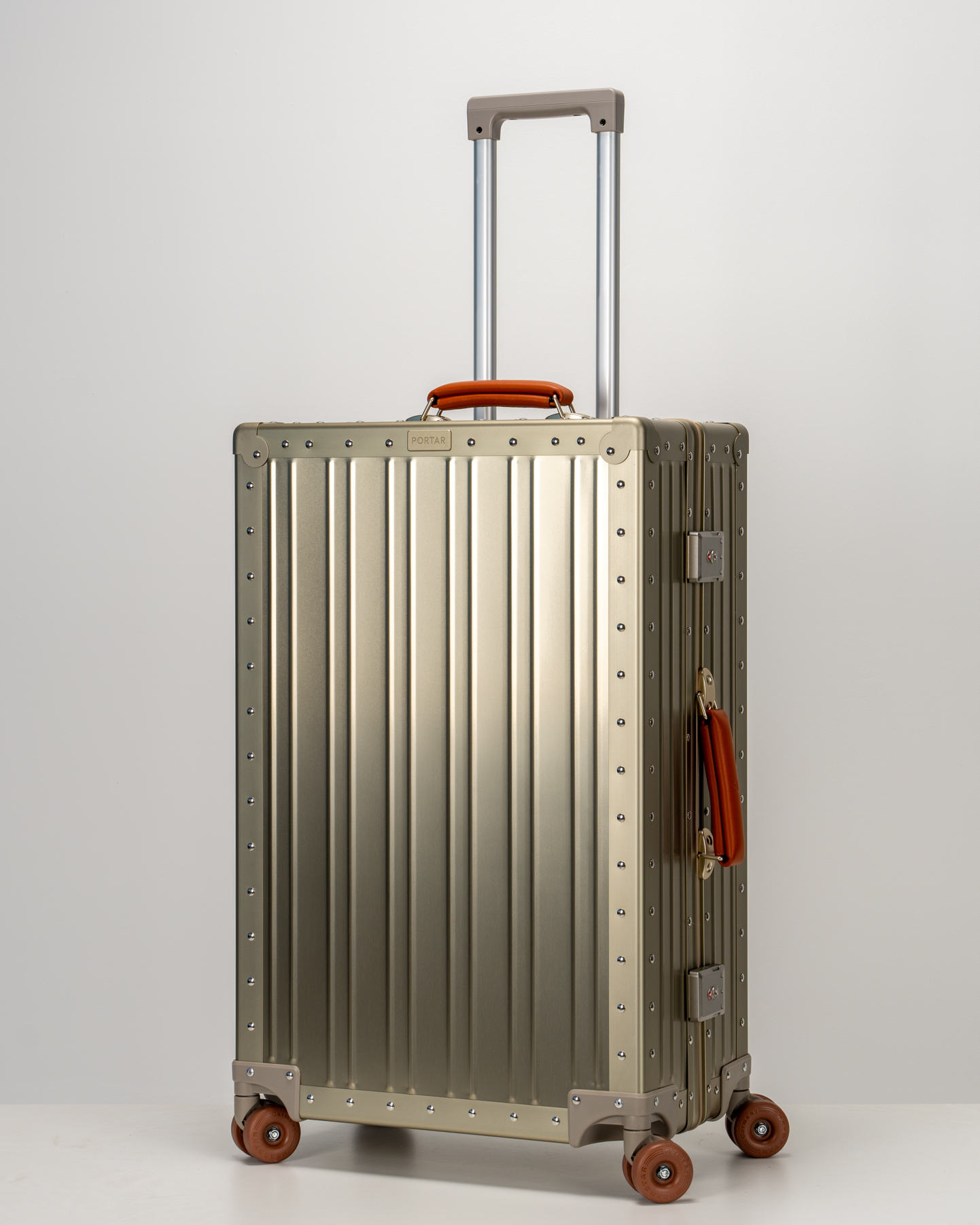 Lucent Champagne Gold Aluminum Check-In Suitcase Perspective with Handle View by Portar