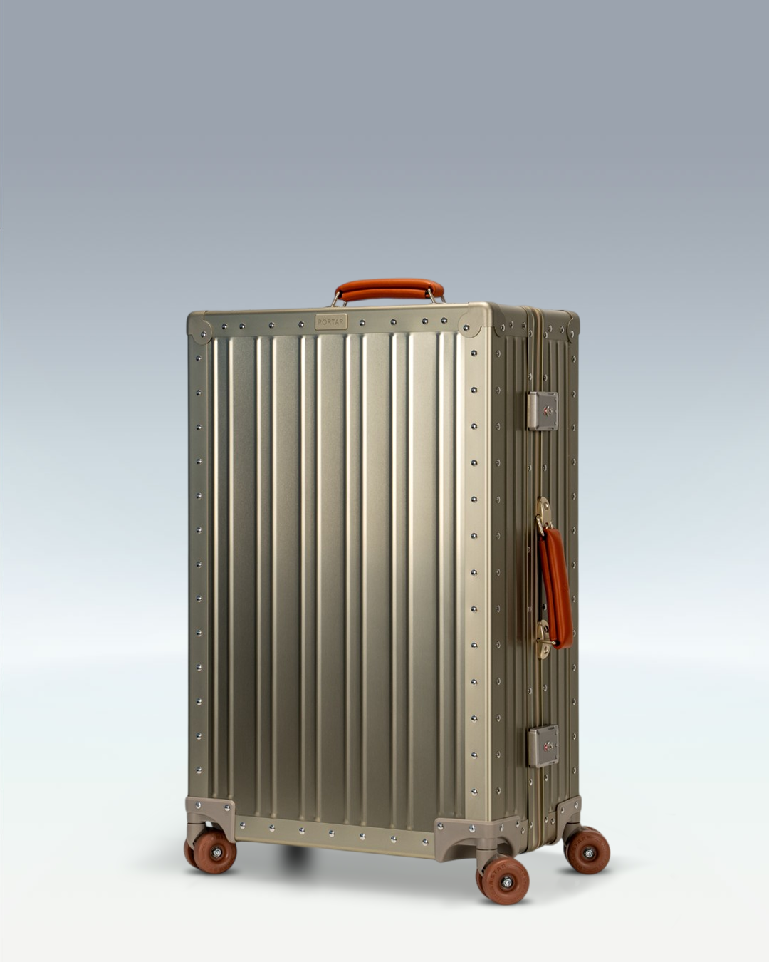 Portar Lucent aluminum checked luggage in Champagne Gold, three-quarter front view
