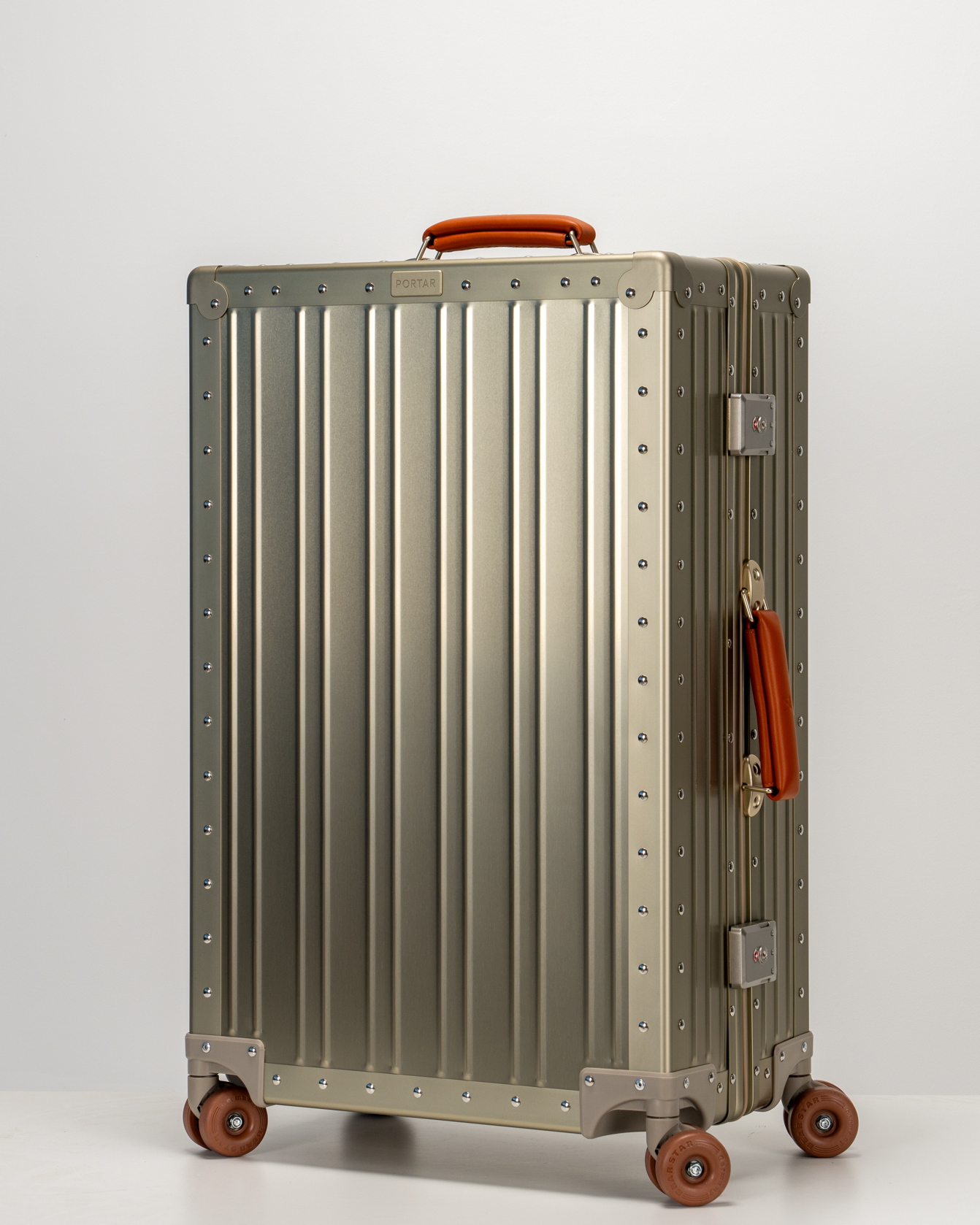 Lucent Champagne Gold Aluminum Check-In Suitcase Perspective View by Portar