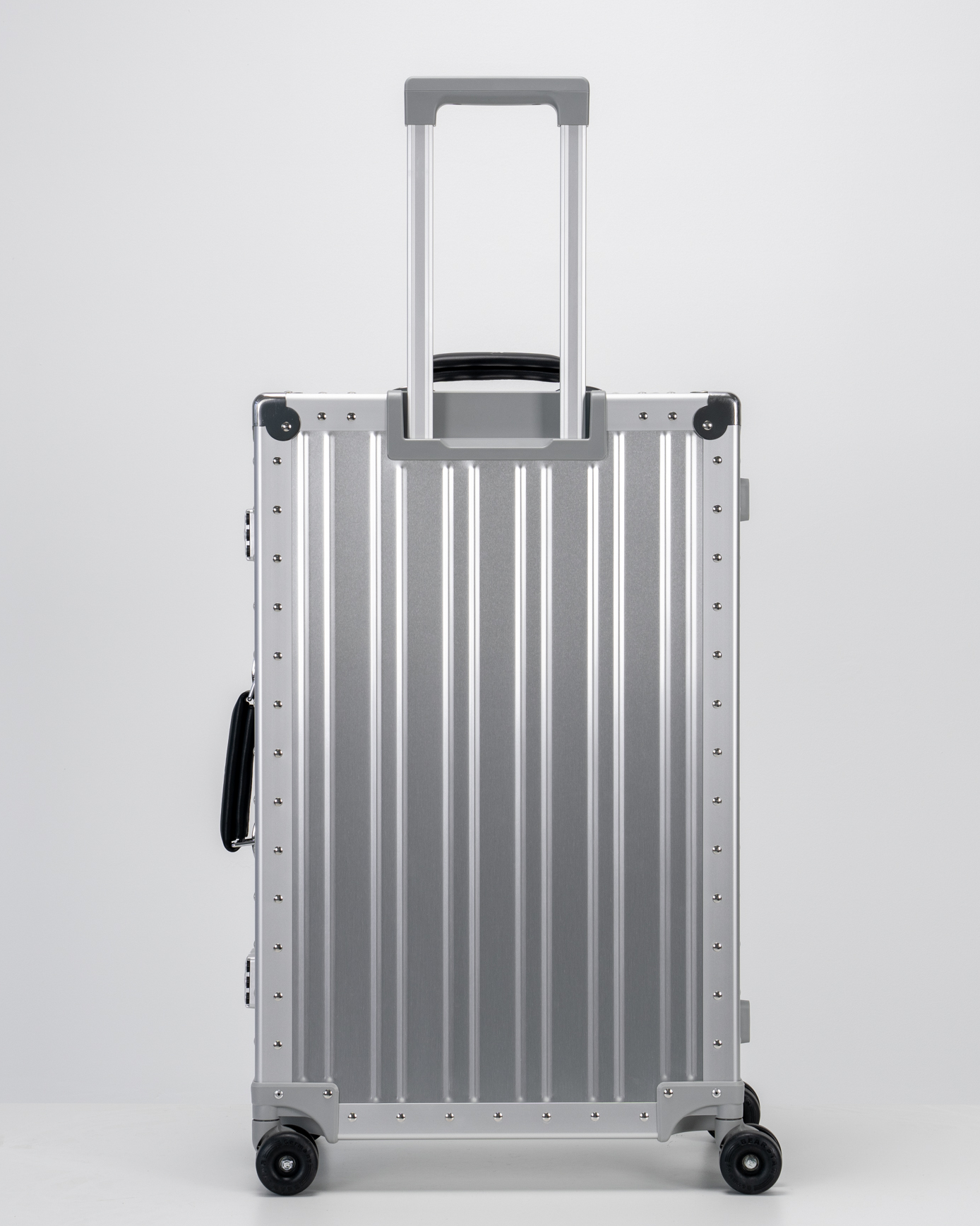 Lucent Lunar Silver Aluminum Check-In Suitcase Back with Handle View by Portar