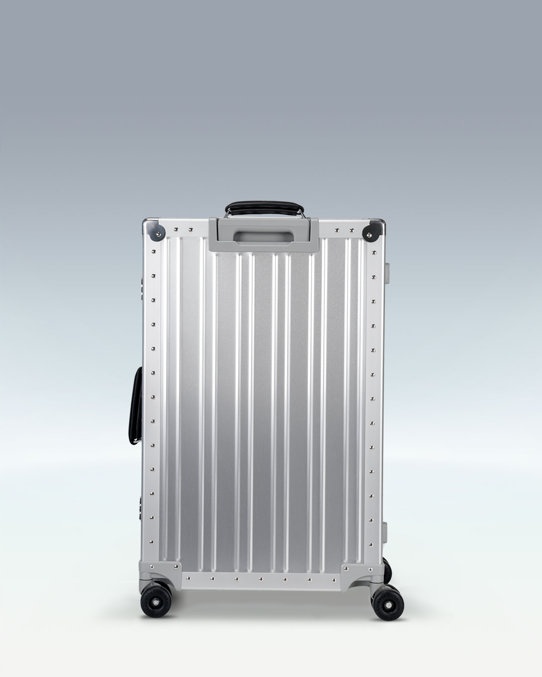 Portar Lucent aluminum checked luggage in Lunar Silver, back view