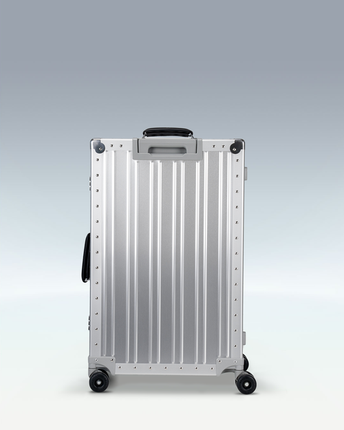 Portar Lucent aluminum checked luggage in Lunar Silver, back view