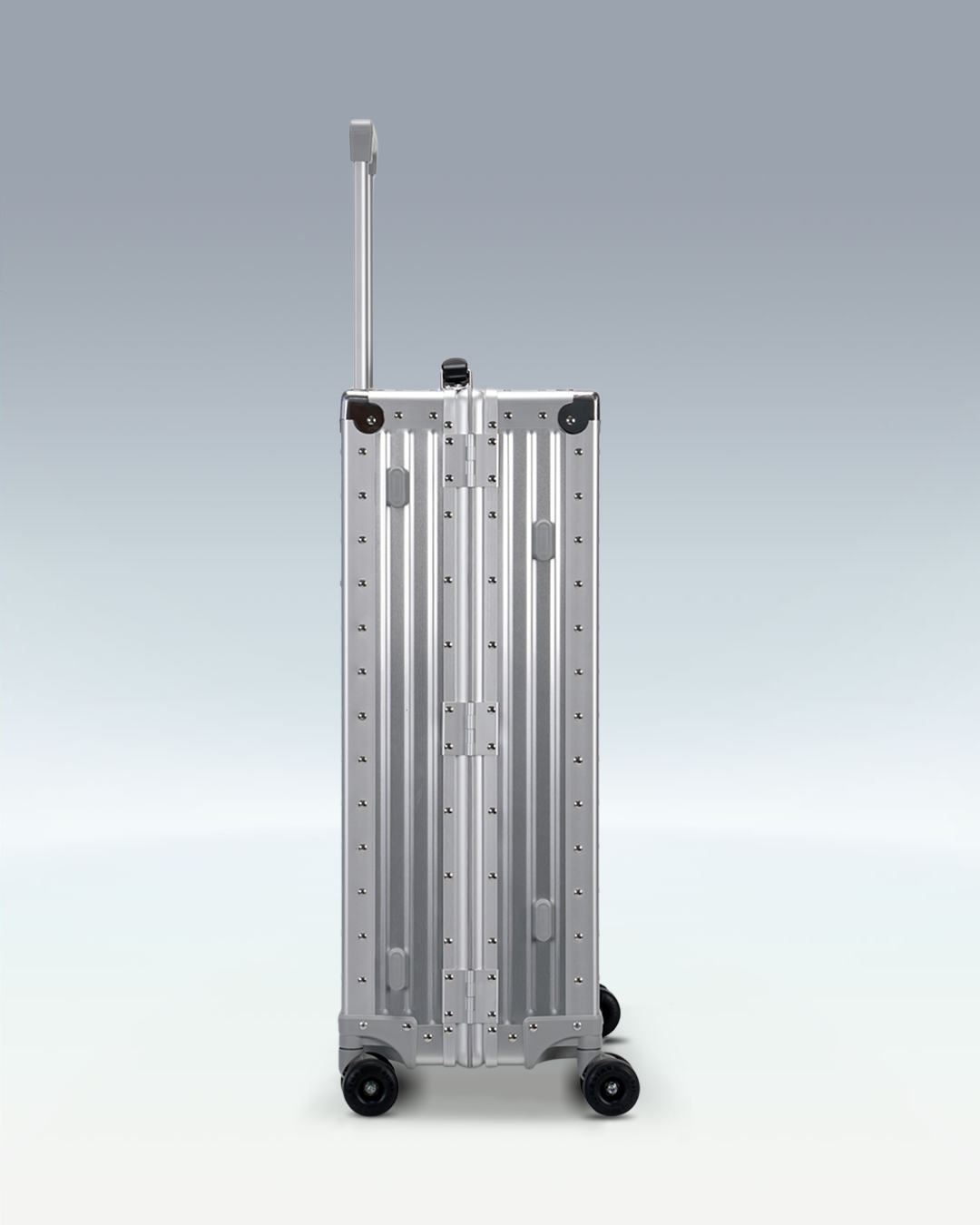 Portar Lucent aluminum checked luggage in Lunar Silver, side profile