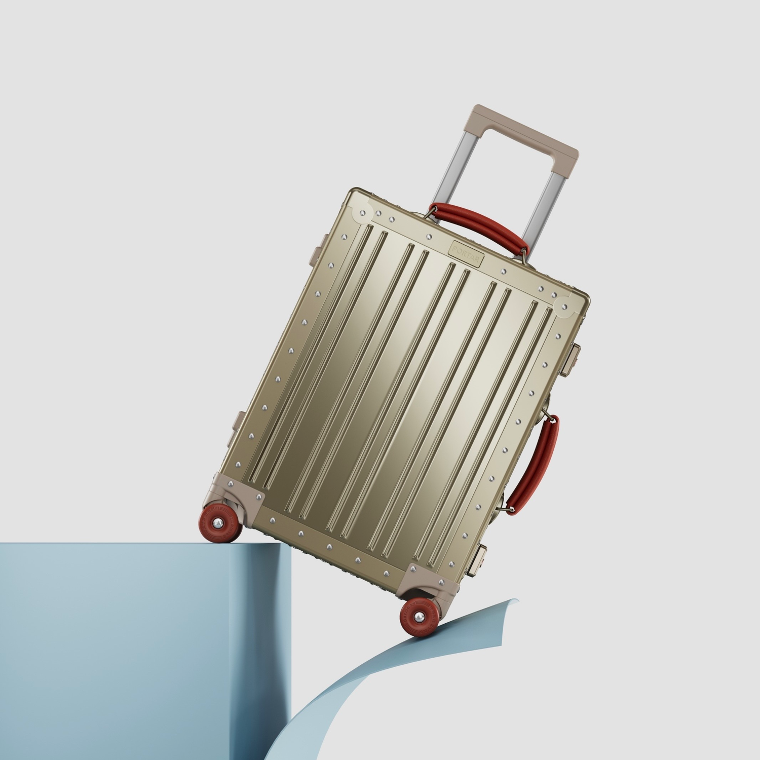 Gold suitcase with red accents on a light blue and white background