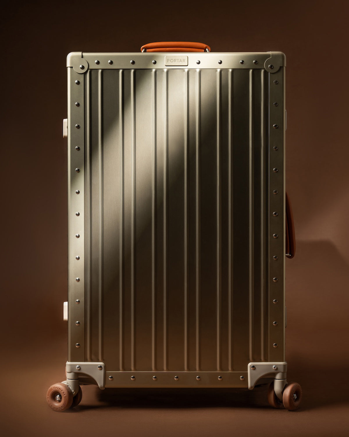 Portar Gold Aluminum Carry on Suitcase in Focus