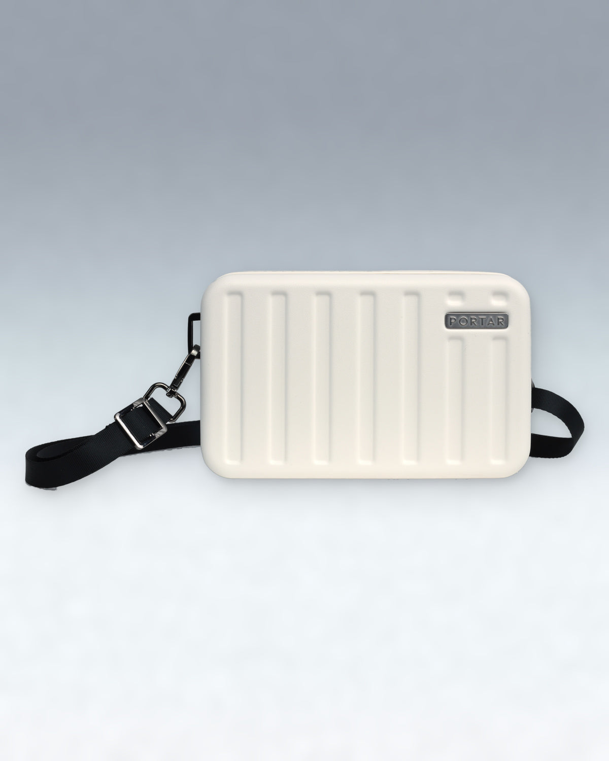 An Cloud Dancer White rectangular Portar Crossbody bag with vertical ridges, a black shoulder strap, and a small silver brand plaque reading 'BONITO', shown on a light gray gradient background.