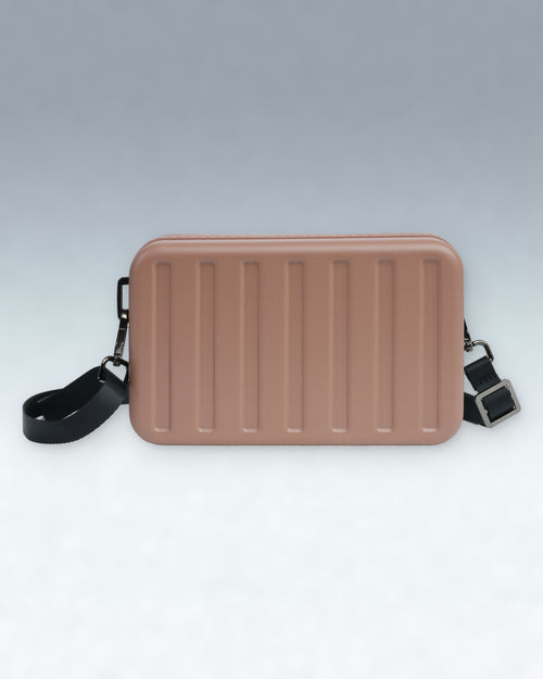 A rectangular Portar Mocha Mousse Brown crossbody bag with vertical ribbed detailing on the front, featuring a black adjustable shoulder strap with silver hardware, set against a clean gray gradient background.