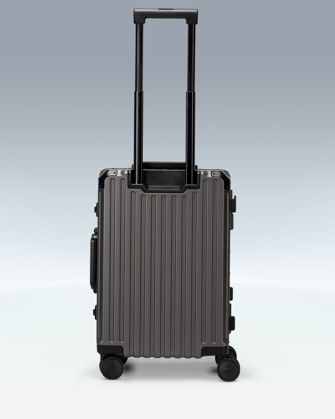 Portar Valence EdgeFrame carry-on luggage in Dark Gull Gray, back view with the telescoping handle extended