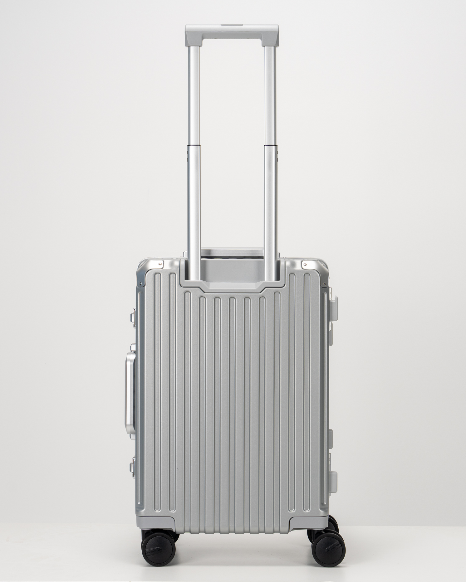 Valence Lunar Silver Polycarbonate Shell with Aluminum EdgeFrame Carry-On Suitcase Back with Handle View by Portar