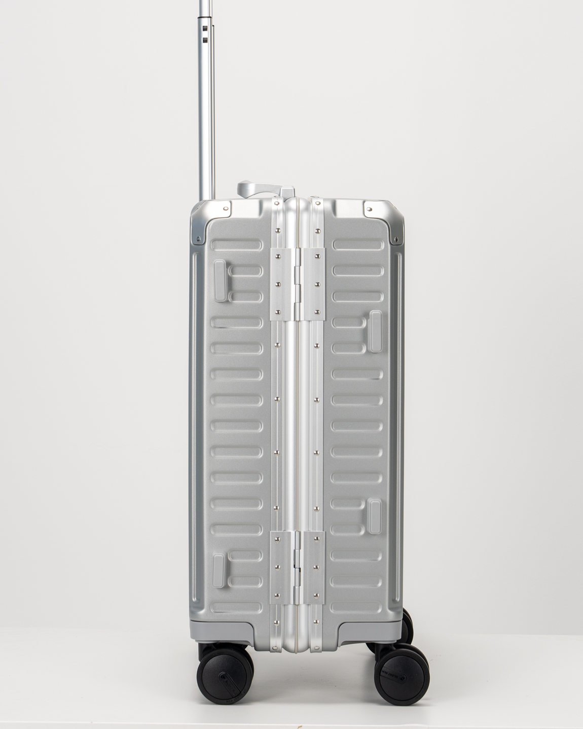 Valence Lunar Silver Polycarbonate Shell with Aluminum EdgeFrame Carry-On Suitcase Side View by Portar