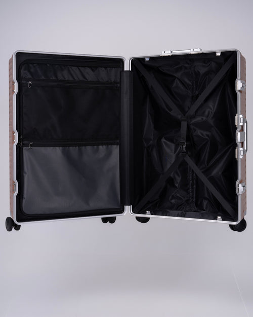 Portar polycarbonate shell with aluminum EdgeFrame Mocha Mousse Brown suitcase interior details with black interior on a light gray background
