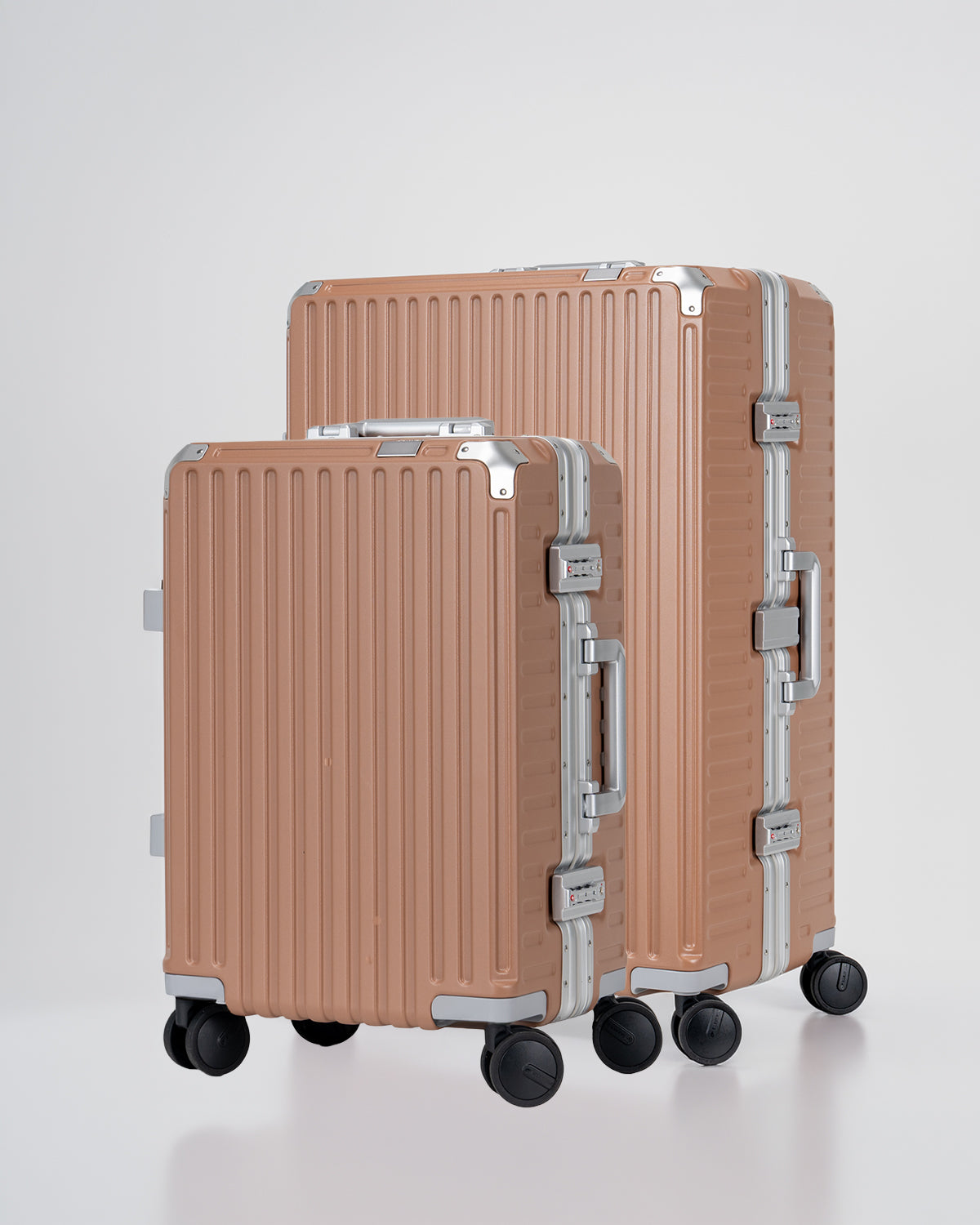 Two Portar Mocha Mousse brown suitcases with silver handles bundled as a travel set on a light gray background