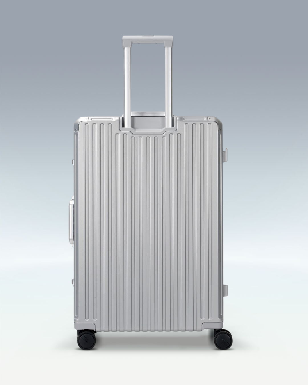 Portar Valence EdgeFrame checked luggage in Lunar Silver, back view with the telescoping handle extended