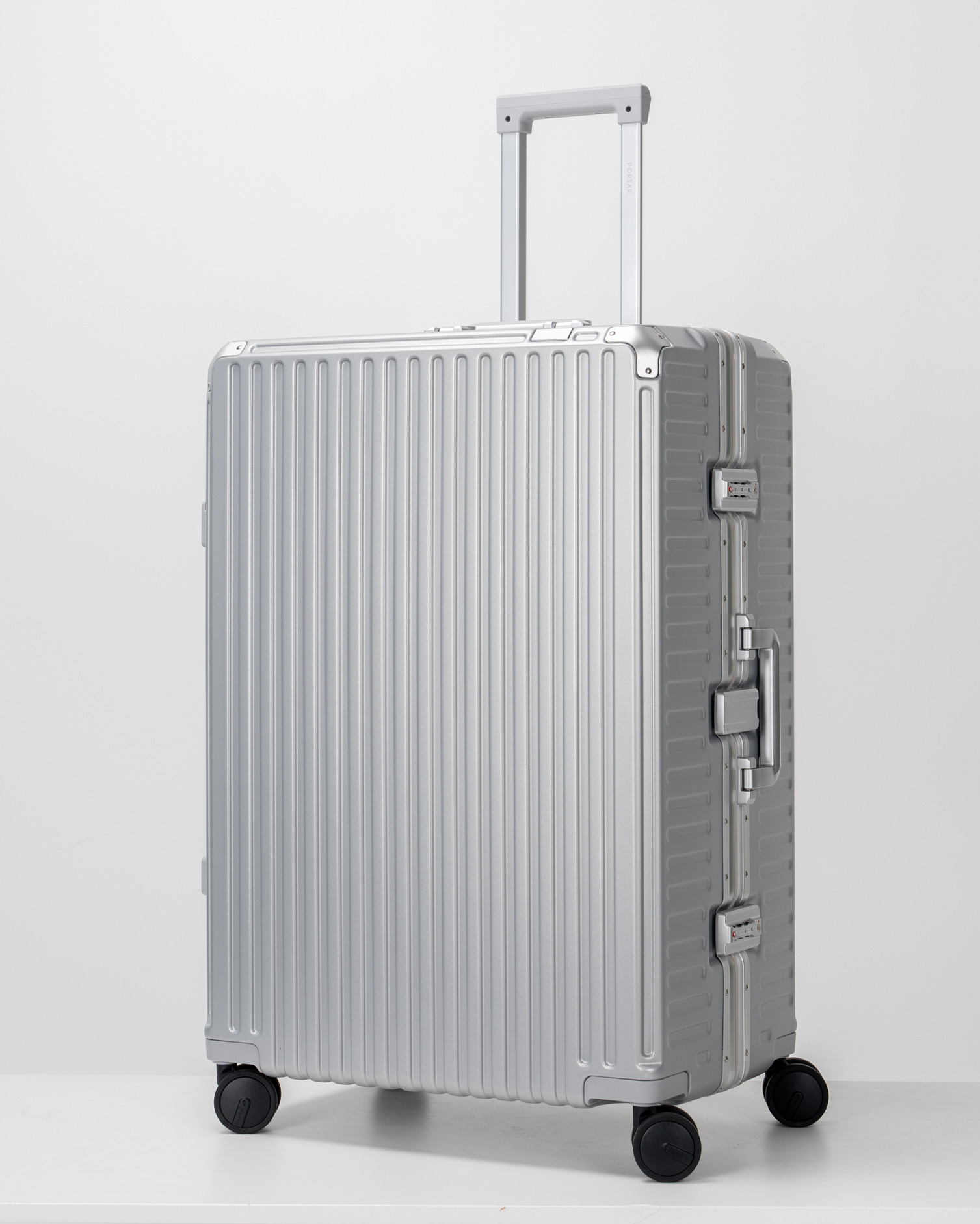 Valence Lunar Silver Polycarbonate Shell with Aluminum EdgeFrame Check-In Suitcase Perspective with Handle View by Portar