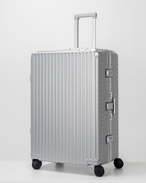 Valence Lunar Silver Polycarbonate Shell with Aluminum EdgeFrame Check-In Suitcase Perspective with Handle View by Portar