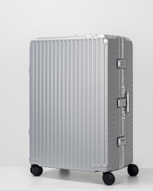 Valence Lunar Silver Polycarbonate Shell with Aluminum EdgeFrame Check-In Suitcase Perspective View by Portar