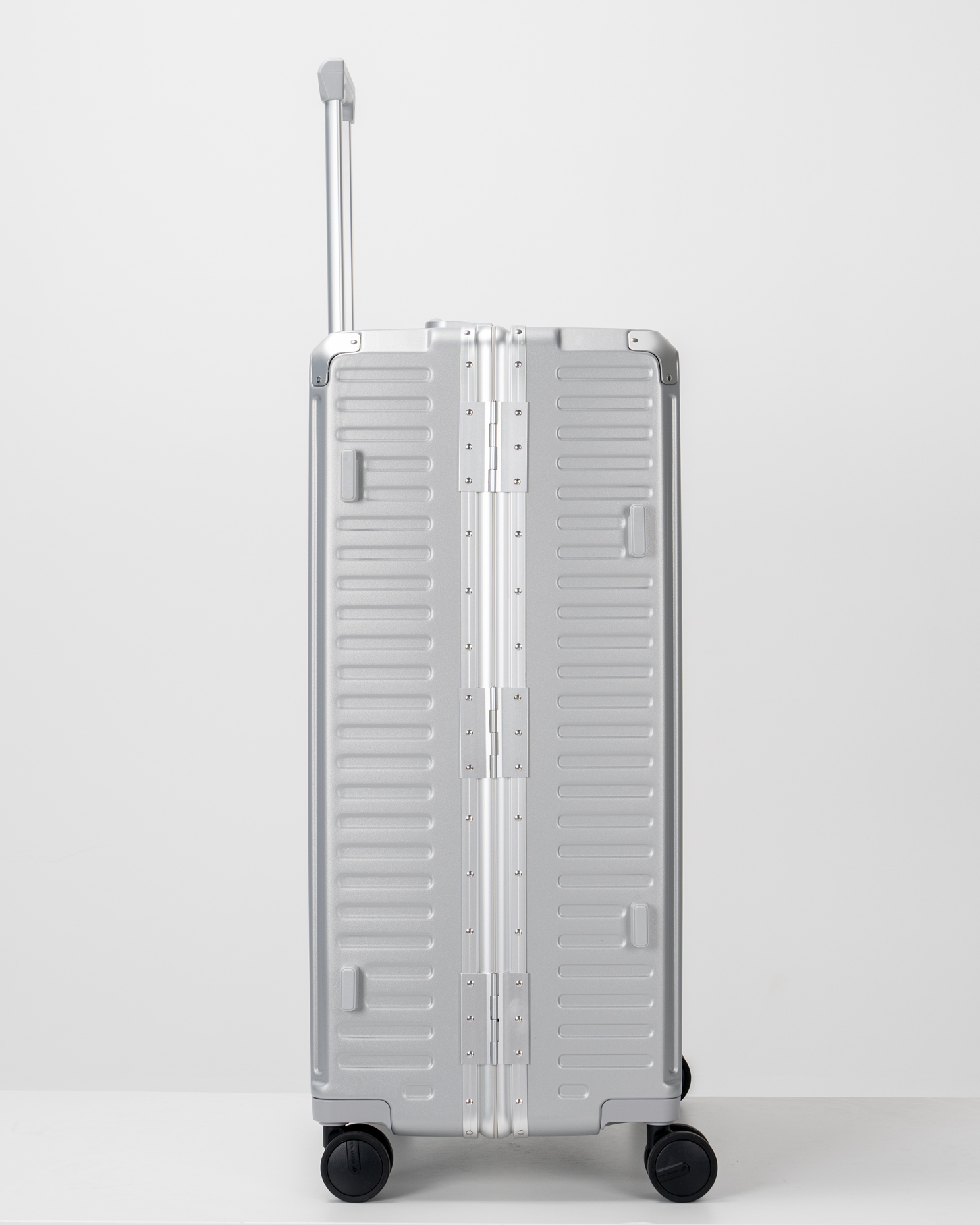 Valence Lunar Silver Polycarbonate Shell with Aluminum EdgeFrame Check-In Suitcase Side View by Portar